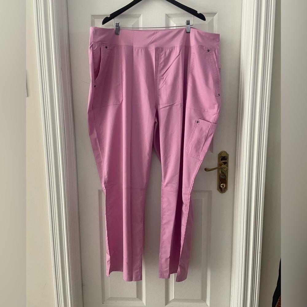 Woman’s light pink scrubs